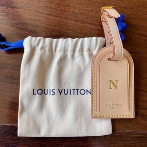 Louis Vuitton leather luggage tag.